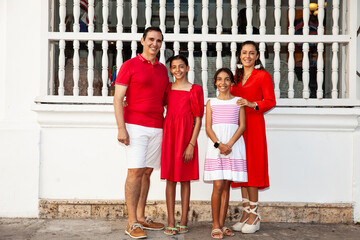Young family of four traveling together. Family love concept. Travel concept. Cartagena de Indias.