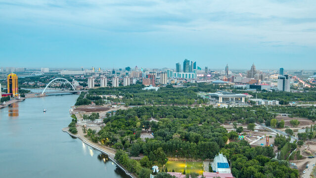 Elevated view over the city center with river and park and central business district day to night Timelapse, Kazakhstan, Astana