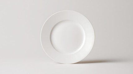 Vibrant photo of minimalistic white plate on a clean background perfect for showcasing food or table settings in a modern dining environment.