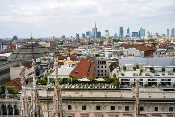 View of the skyline of Milan from the Duomo rooftop , on the background the newly developed financial quarter area near Porta Garibaldi