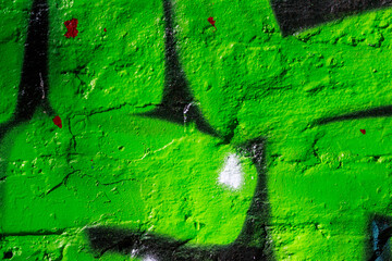 Concrete wall painted in acid bright green color, abstract background
