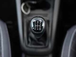 Close-Up of Manual Transmission Gear Knob with 5 Gears