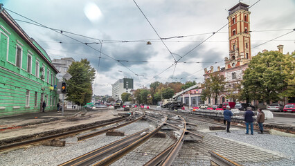 Repair works on the street timelapse. Laying of new tram rails on a city street.