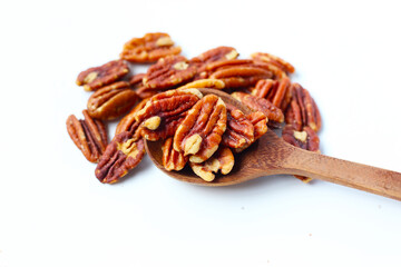 Delicious salted pecan nuts scattered.