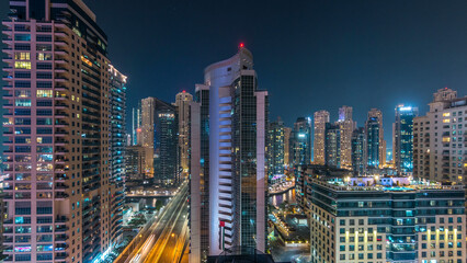 Obraz premium Aerial view of Dubai Marina from a vantage point night timelapse.