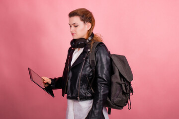 Woman with headphones, listening to music, fashion model in studio posing, music genre, smiling, rock, metal music