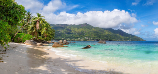 Panoramic view of tropical Sunny beach and turquoise sea on Beau Vallon beach, Seychelles. Summer vacation and tropical beach concept.