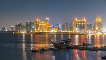 Fototapeta premium View from Katara Beach day to night timelapse in Doha, Qatar, towards the West Bay and city center
