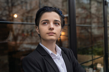 Portrait of young businesswoman in suit