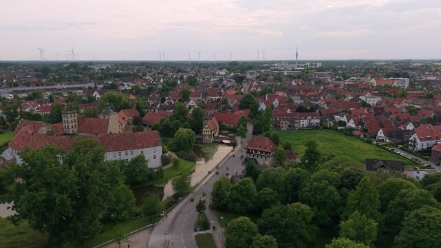 A panoramic drone view of the city and the castle, which sits on the water, in Steinfurt, Germany (Wasserschloss Burgsteinfurt)