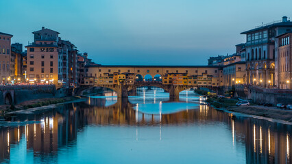 River Arno and famous bridge Ponte Vecchio day to night timelapse after sunset in Florence, Tuscany, Italy