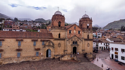 Fototapeta premium Mongui, Boyaca - Colombia. May 10, 2025. Panoramic drone view of the town's main church.