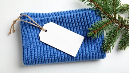 Blue Knitted Napkin Mockup with Blank Tag and Winter Branches