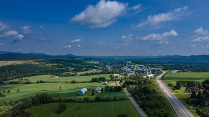 Fototapeta premium Aerial view of a small rural village on a beautiful summer day
