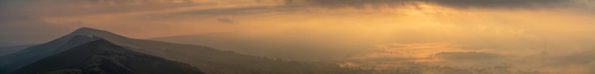 Misty sunrise panorama of Hope Valley with cloud inversion near Castle ton. Peak District. England