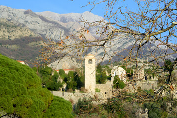 Picturesque view of Clock Tower in Old Town Bar (Stari Grad Bar) on the background of majestic Balkans mountains in Montenegro