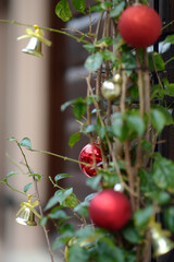 View of Christmas decoration hanging on door of restaurant on the street of the Old Bar Town in Montenegro