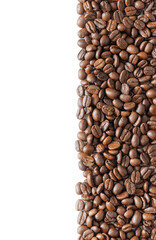 Many roasted coffee beans on white background. Coffee beans border with area for copy space. Close up images.