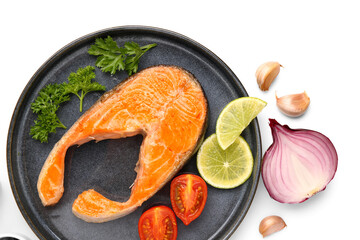 Plate of tasty fried salmon steak on white background