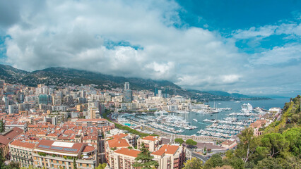 Monte Carlo city aerial panorama timelapse. View of luxury yachts and apartments in harbor of Monaco, Cote d'Azur.