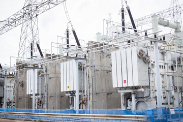 Power substation infrastructure with high voltage transformers and electrical equipment in industrial setting ensuring energy distribution and safety