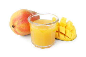 Tasty mango juice in glass and fresh fruits isolated on white