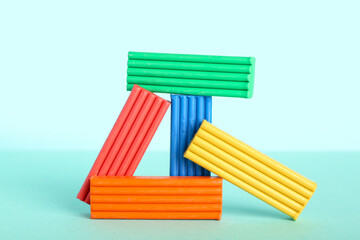Colorful plasticine on blue background