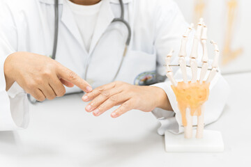 Orthopedist explain to the patient for human hand and fingers bone injury treatment program.Doctor...