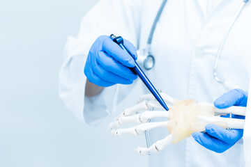 Orthopedist explain to the patient for human hand and fingers bone injury treatment program.Doctor...