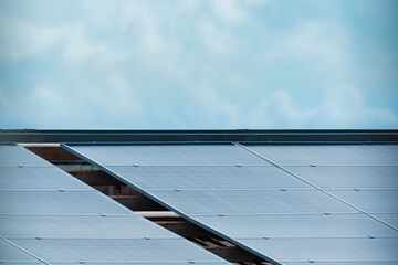 Solar panels and blue sky background.Solar cells farm on the roof and sunset.Photovoltaic modules...