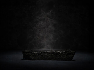 black stones with texture on dark background for cosmetic podium backdrop