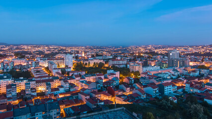 Rooftops of Porto's old town on a warm spring evening timelapse day to night, Porto, Portugal