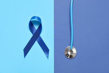 Blue ribbon with stethoscope on color background. Prostate cancer awareness concept