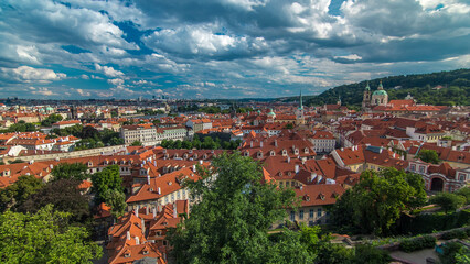 Panorama of Prague Old Town with red roofs timelapse, famous Charles bridge and Vltava river, Czech...
