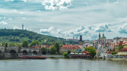Vltava river embankment timelapse in a sunny summer day. Prague, Czech Republic.
