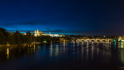 Naklejka premium View of the city Prague in Czech Republic day to night timelapse on the Vltava river with beautiful sky
