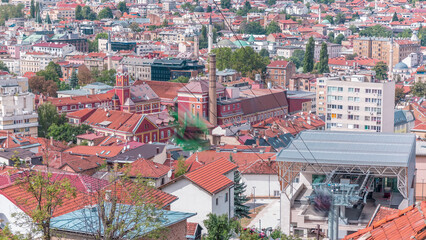 Naklejka premium City panorama with cable car moving up and down from Sarajevo station to mountains, Bosnia And Herzegovina