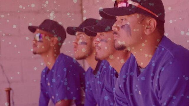 Opening shot showing baseball players in dugout facing field watching game under floating specks