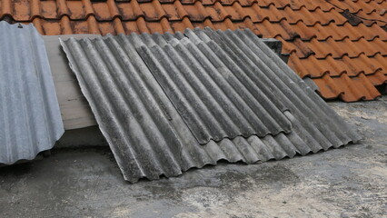 Asbestos Roof Hazard background – Health Risk from Old Roofing Sheets