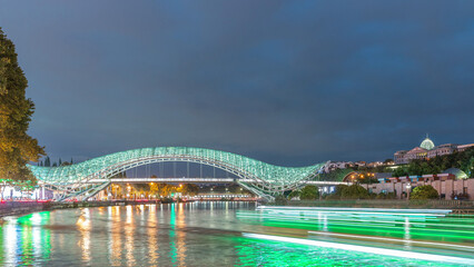 Bridge of Peace day to night timelapse, a bow-shaped pedestrian bridge in Tbilisi, Georgia © HyperlapsePro