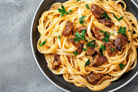 Plate of pasta with meat and parsley