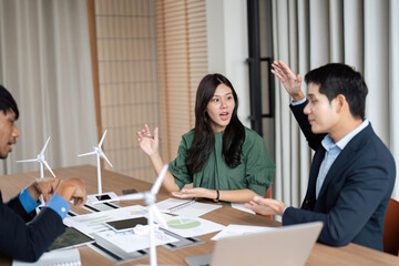 ESG Engagement in Corporate Meeting. Team members discussing sustainability goals.