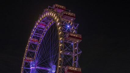 Fototapeta premium Wiener Riesenrad in Prater night timelapse - oldest and biggest ferris wheel in Austria.