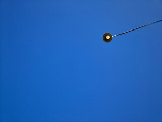 Fototapeta premium Street Lights with Bright Blue Sky Background, this photo is suitable for background, decoration, wallpaper