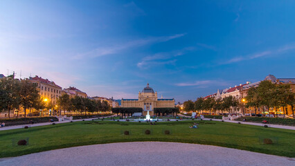 Panoramic day to night timelapse view of Art pavilion at King Tomislav square in Zagreb, Croatia.
