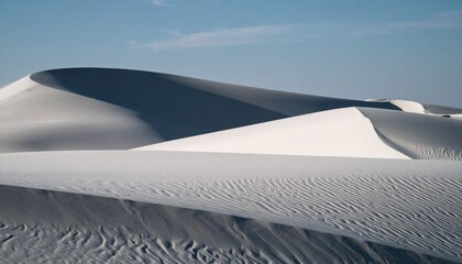 White Sand Dunes Under Blue Sky With Long Shadows and Textured Surfaces in a Desert Landscape