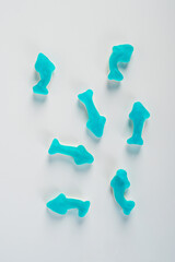 Jelly fish candies. Gummy shark, blue dolphin jelly coated with sugar on a white background.