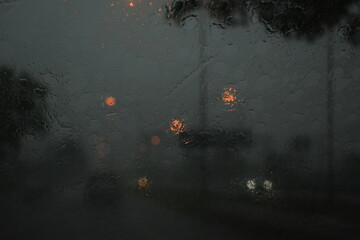 car on highway road in the night with heavy rainny season, blurred image