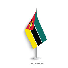 Mozambique table flag on light grey background. Mozambique desk flag isolated on grey background	
