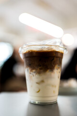 Ice latte with two tones layer separate milk and coffee in cafe